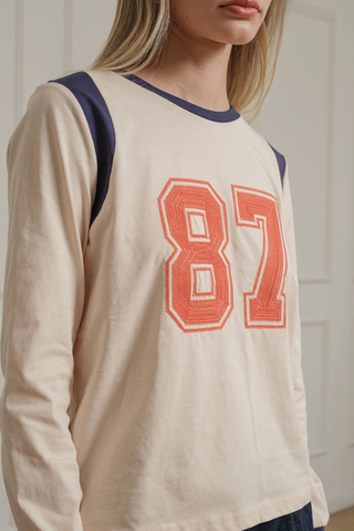 87' Embroidered Long Sleeve Graphic Top