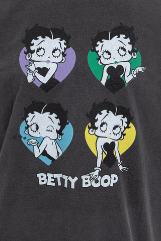 The Daisy Street Betty Boop Hearts Graphic Tee features four cartoon Betty Boop images in purple, green, blue, and yellow heart shapes with playful poses and Betty Boop text below on dark fabric. FINAL SALE.