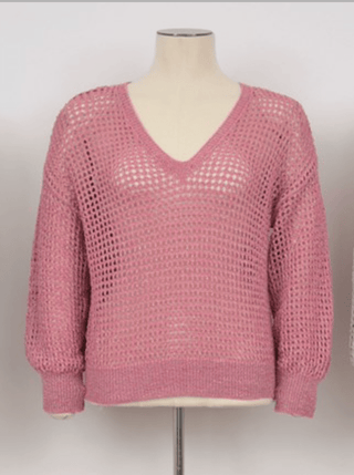 A mannequin showcases the Molly Bracken Open Weave V-neck Knit Sweater-FINAL SALE, a pink, long-sleeve sweater with a loose open-knit design—ideal as a lightweight layer for summer.